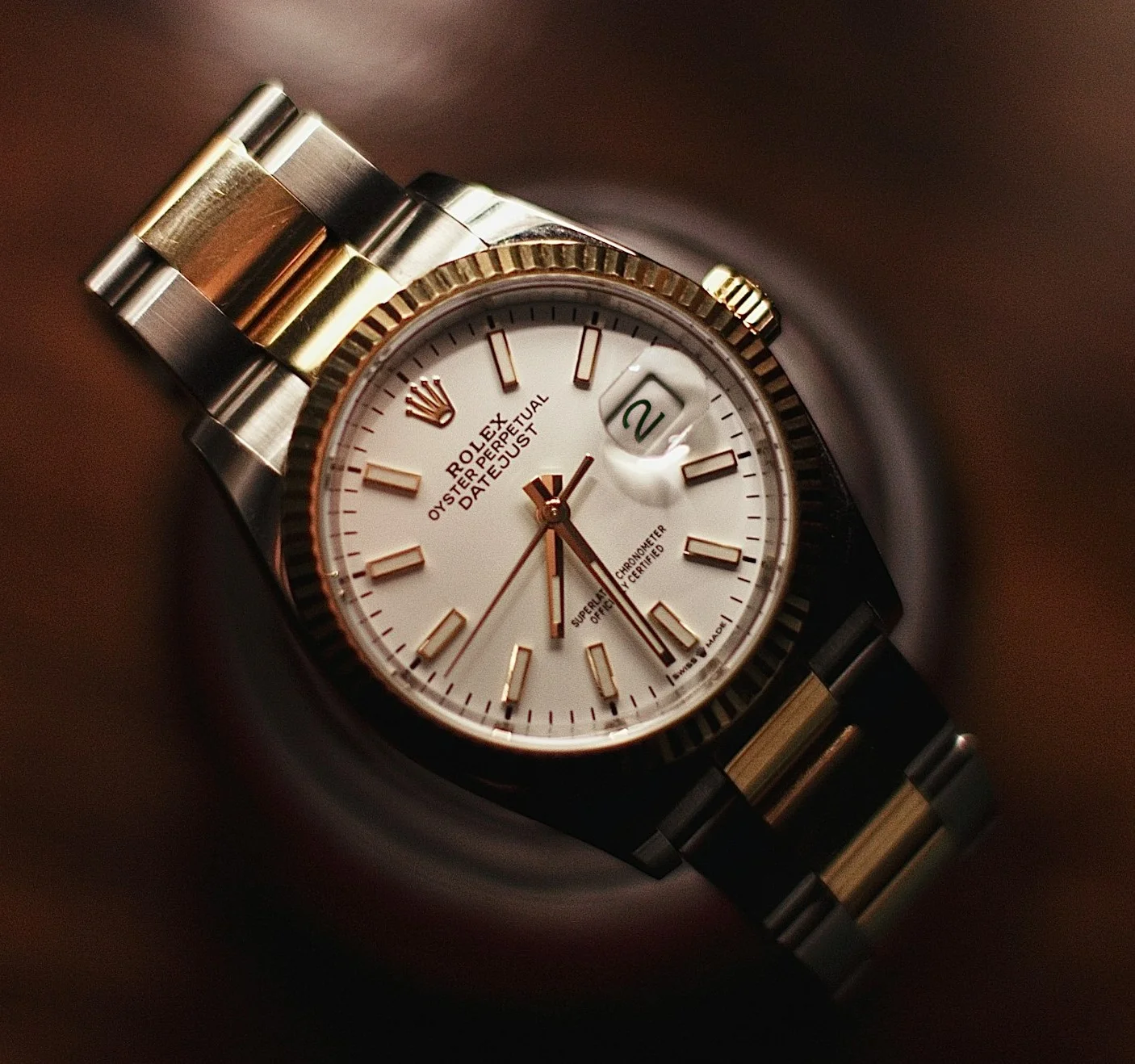 A close-up of the Rolex dress watch with two-tone (silver-gold) finishing.