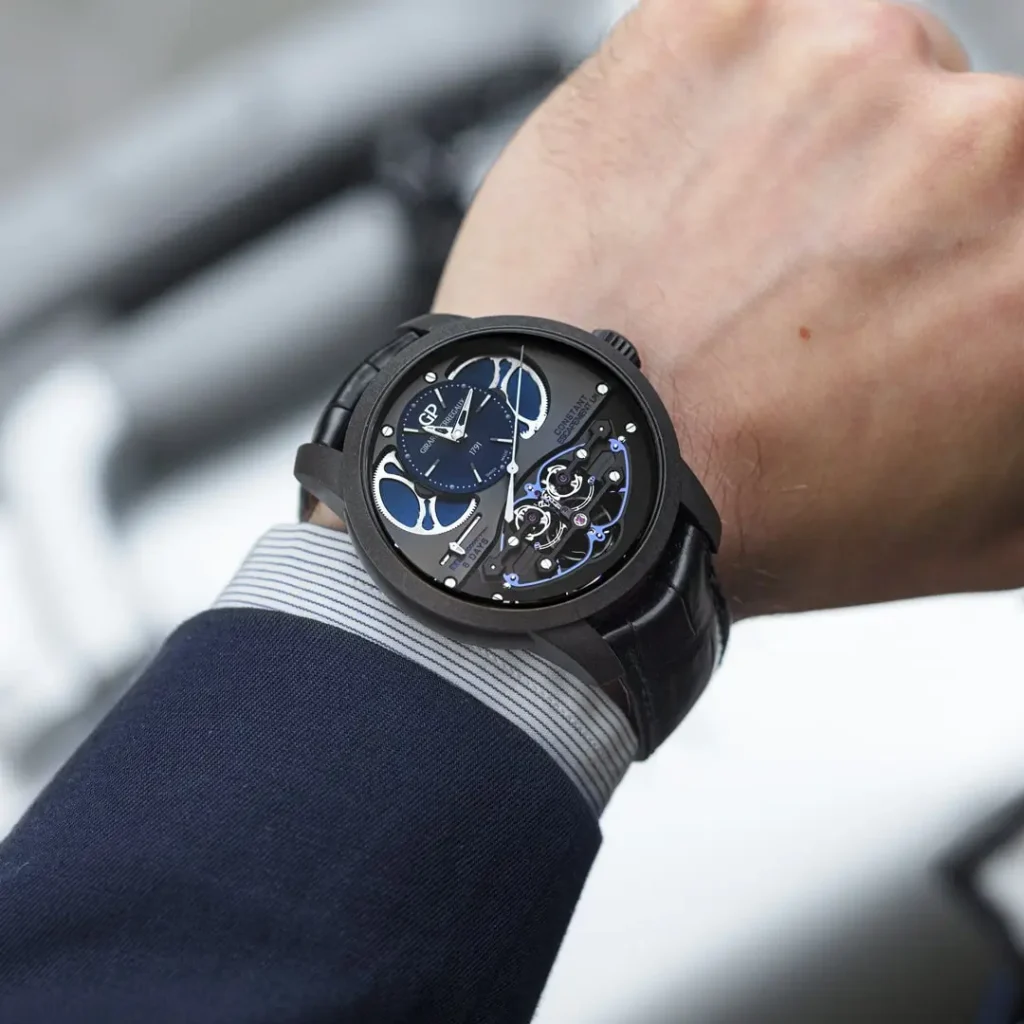 Close-up of a Girard-Perregaux watch worn on a man's wrist.