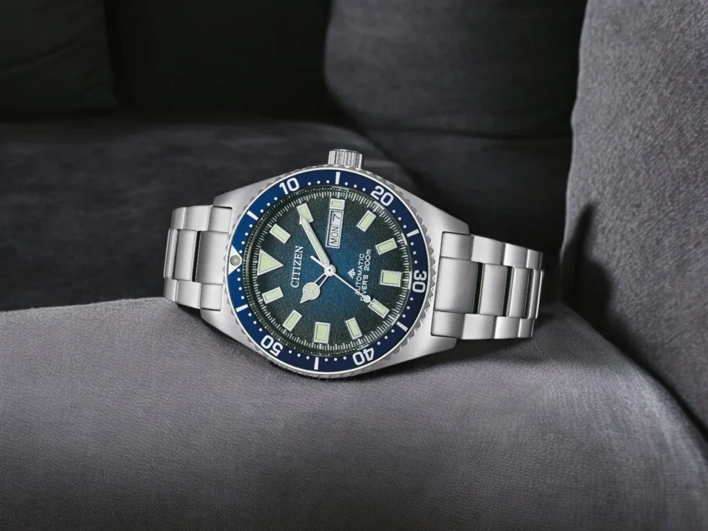 Citizen Promaster Marine NY0129-58L sits on a soft, dark gray fabric surface.
