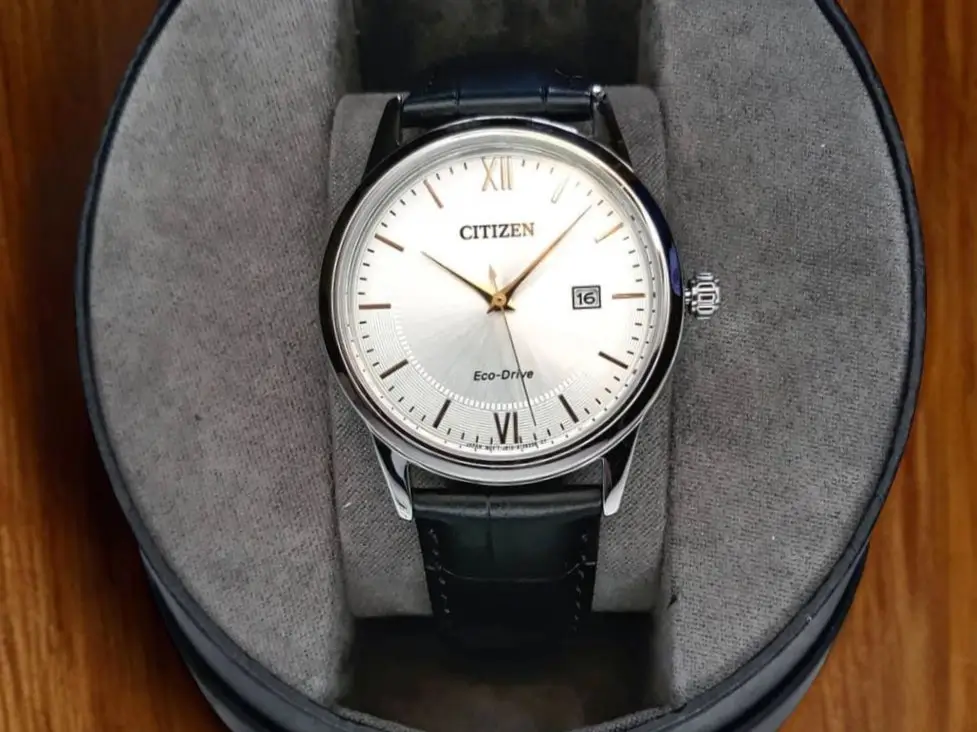 Front view of the Citizen Corso Eco-Drive AW1236-03A watch is inside its presentation box.