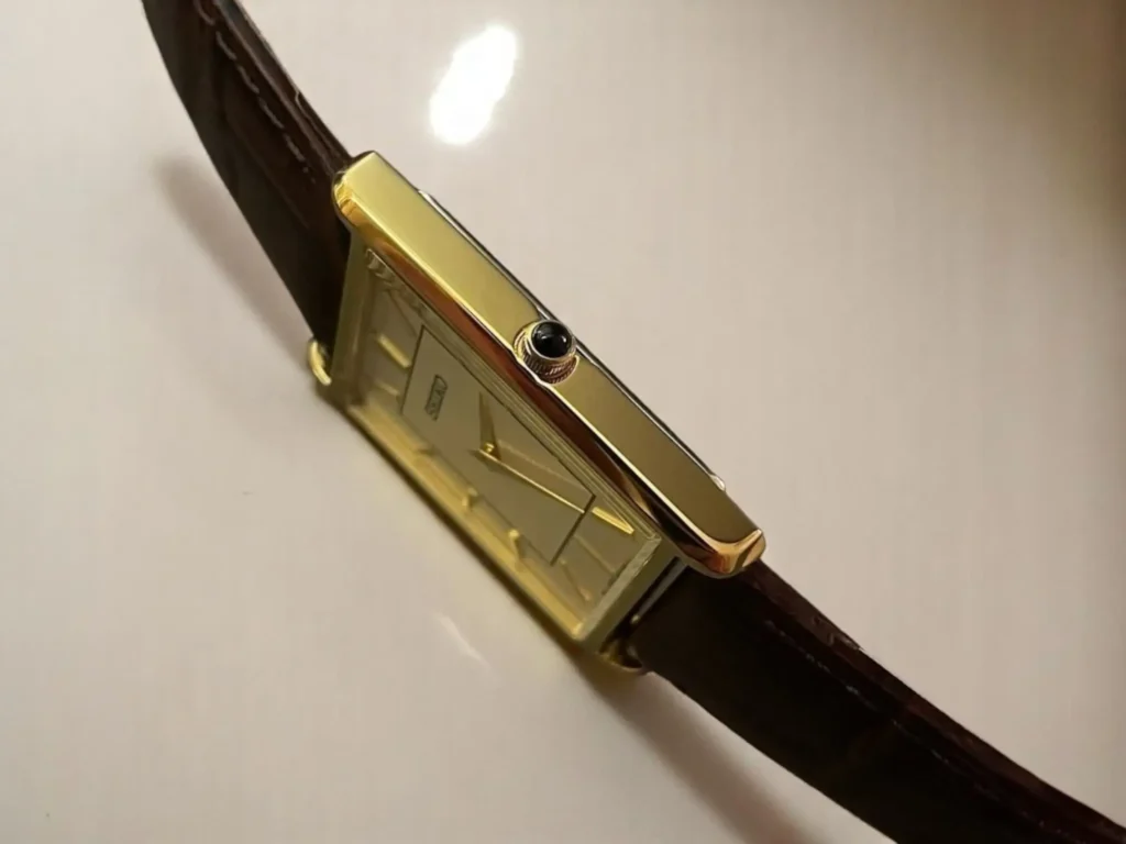 A close-up view of the cabochon crown of the Seiko Essentials SWR064, captured from an angle.