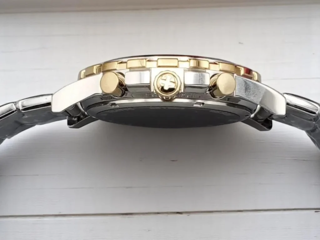 Side view of a Fossil Dean Chronograph FS4795 showcasing a crown, a golden bezel, and prominent buttons. 