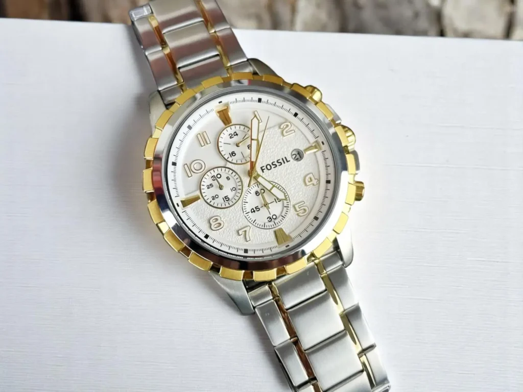 Close-up of the Fossil Dean Chronograph FS4795 on a white textured surface.