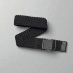 Arcade black stretch belt featuring a minimalist logo on a grey background.