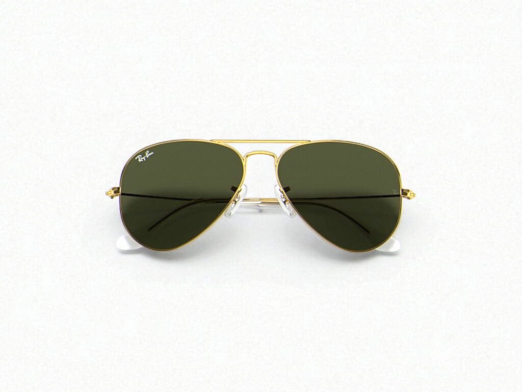 Gold-framed Ray-Ban aviator polarized sunglasses with dark green lenses on a light gray background.