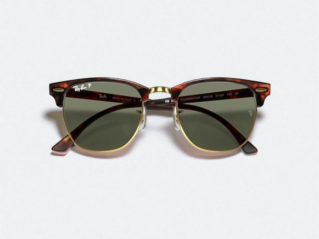 Tortoise-shell sunglasses with gold accents and green lenses, featuring a retro Clubmaster design, centered on a plain white background.