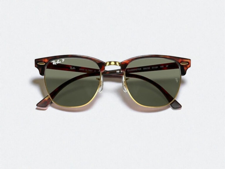 Tortoise-shell sunglasses with gold accents and green lenses, featuring a retro Clubmaster design, centered on a plain white background.