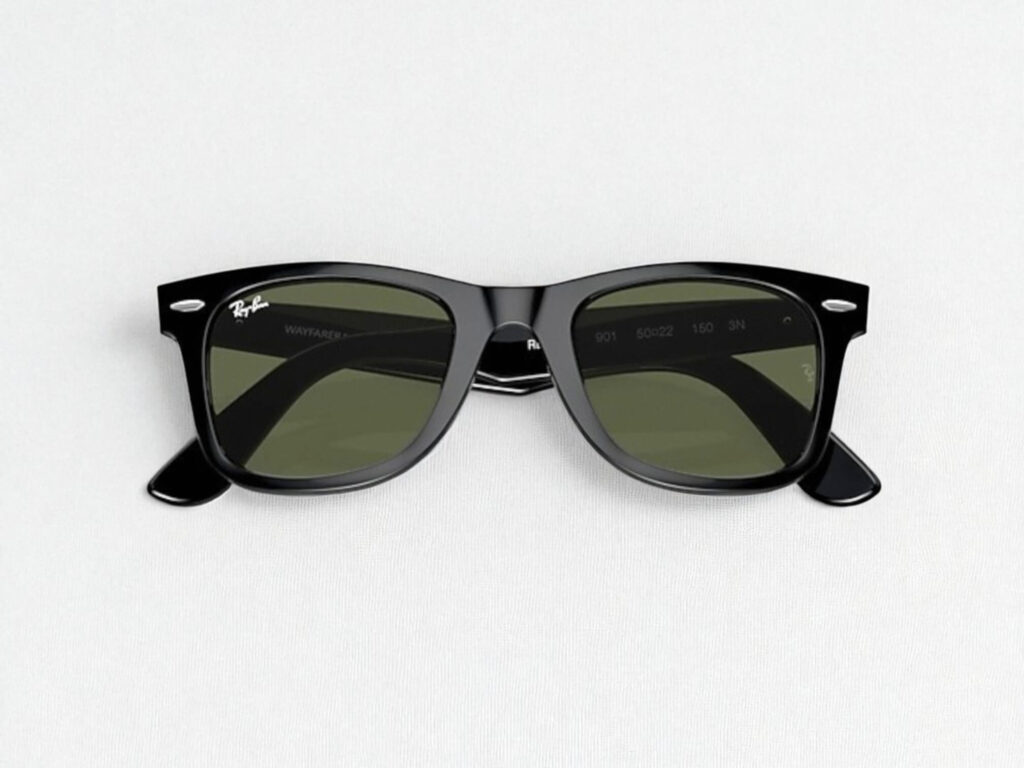 Ray-Ban Wayfarer classic black sunglasses with dark green lenses. The frame is rectangular, sitting on a plain white background.
