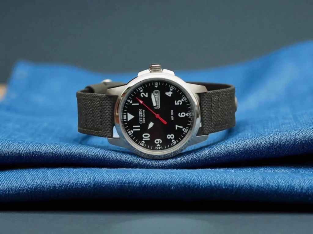 Citizen Eco-Drive BM8180-03E watch resting on layered blue fabric. 
