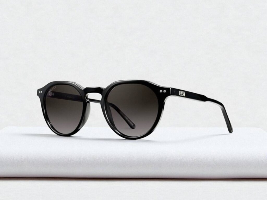 WMP Eyewear P-3 sunglasses with round dark lenses and sleek temples on a white surface.