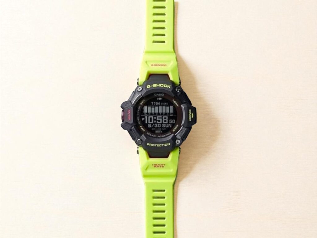 A vibrant lime green G-Shock GBD-H2000 digital watch with a black face, displaying the time 10:58 and date 6/30 Sunday.