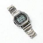 A silver G-Shock GMW-B5000D digital wristwatch with a metal strap on a plain white background.