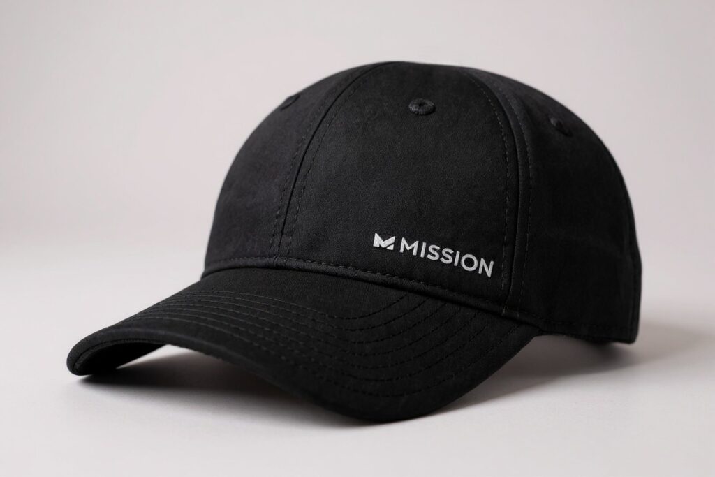 Black curved-brim baseball cap on a plain background with the word "MISSION" in white.