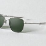 Randolph Engineering silver aviator sunglasses with dark green lenses on a light gray background.